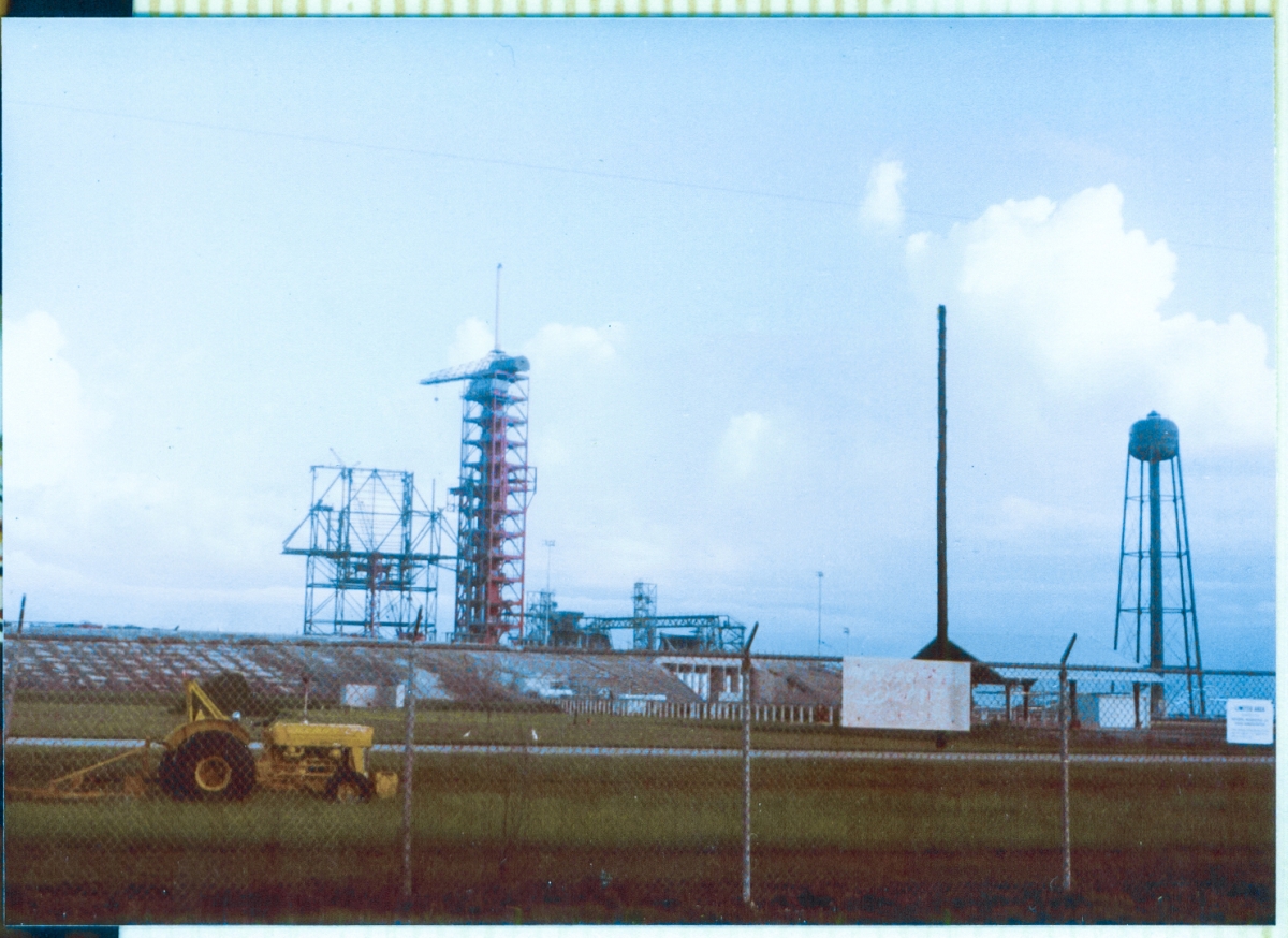 It is the summer of 1980, and you are looking at the Rotating Service Structure at Space Shuttle Launch Complex 39-B, Kennedy Space Center, Florida, as it was being assembled by Union Ironworkers from Wilhoit Steel Erectors, from the primary structural elements which were fabricated and delivered to the pad by Sheffield Steel. Your point of view is one of driving to the job site in the morning, along the access road to the pad which branches off of Beach Road, and bends left just as it reaches the pad perimeter fence, which it goes around until it meets the Crawlerway at the foot of the Pad Slope.